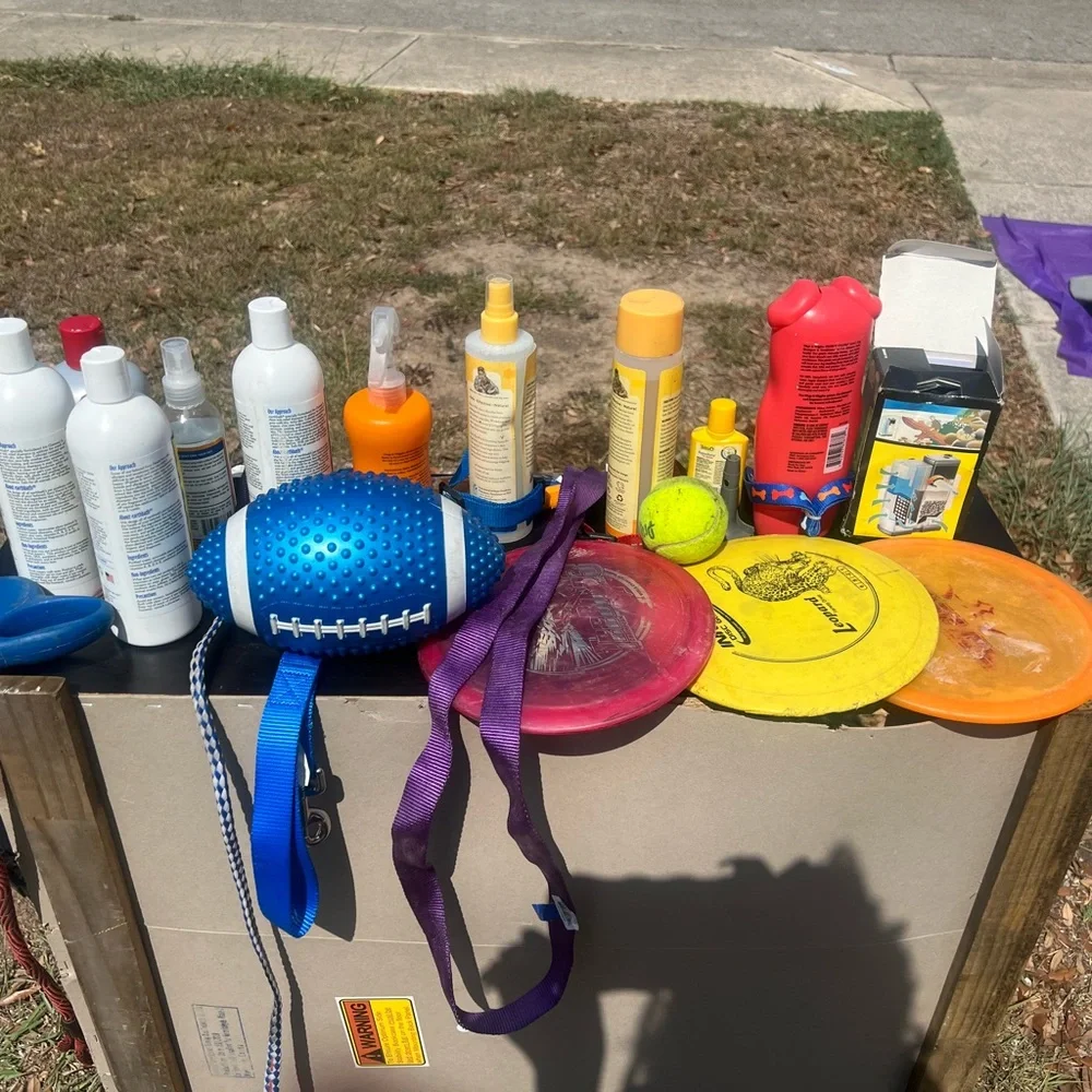 Leashes shampoo conditioner and dog bowls and toys
